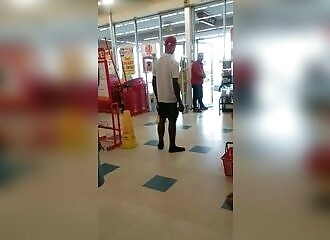 A riffraff refuses to leave a store, so the security guard has to force him a little