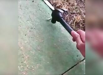 He hits a .22 with a hammer and shoots himself in the leg (Warning - shocking)