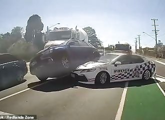Fugitives get stuck on a police vehicle as they try to escape