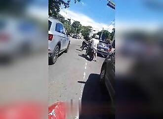   A biker insults a motorist and is hit with crutches   