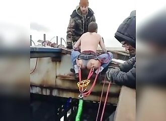 He does a pendulum jump with the straps attached to his buttocks