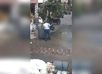 A huge tank of water falls on her as she makes a donation to a temple