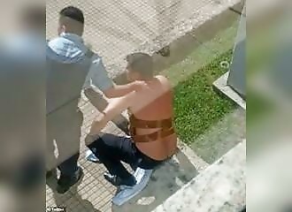 Police officer calms bank manager terrorized by a bomb strapped to his chest in Brazil