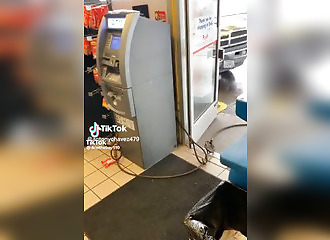 They try to steal an ATM in a store in broad daylight!