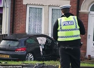 He drives at full speed and crashes into a house
