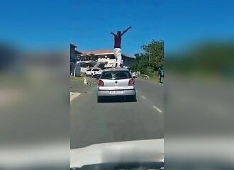 He stands on a moving car and pays dearly