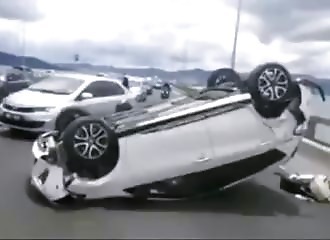 He slaloms between the cars, it ends badly for him