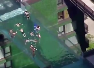 WOULD YOU? Swimmers Enjoy Some Time In A Pool Suspended 100 Feet Between Two Buildings In London - Videos - VidMax.com
