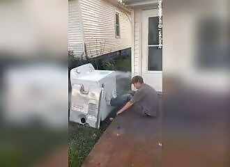 Moron places firecrackers in a washing machine and nearly kills himself