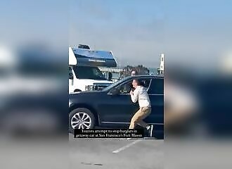 Tourists try to stop a thug stealing their car in San Francisco