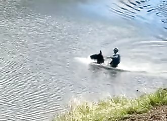 Reno Ward, son of Darrell Ward (Ice Road Truckers) laughs as his horse drowns