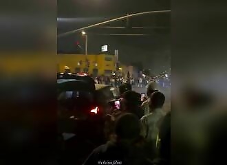 A motorist stumbles into an illegal street rally and narrowly escapes being beaten